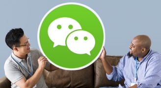 Men showing a WeChat icon